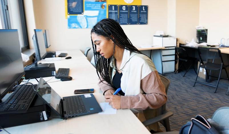 mount mercy university student studying in the jedi room.