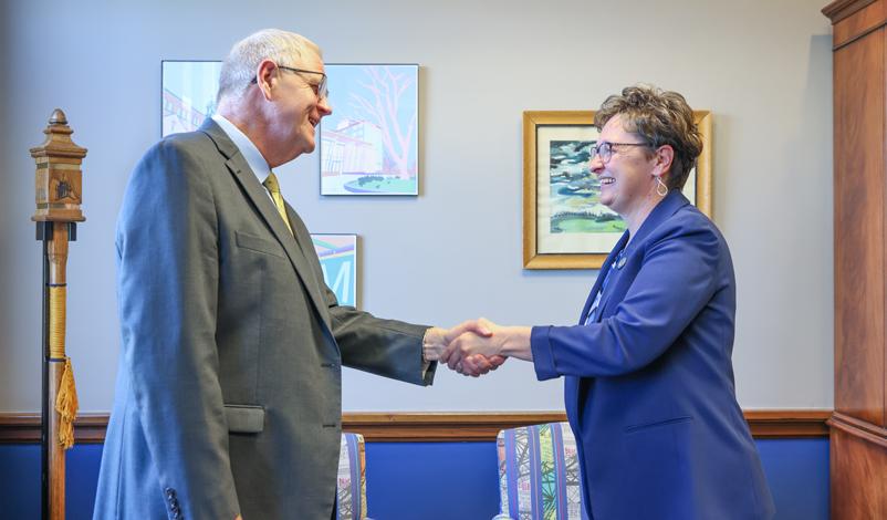 Presidents Novak and Olson shaking hands